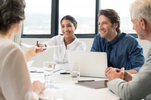 Accountant giving report to senior manager.